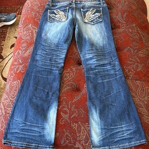 Vanity Distressed Blue Flare Jeans with Embroidered Pockets